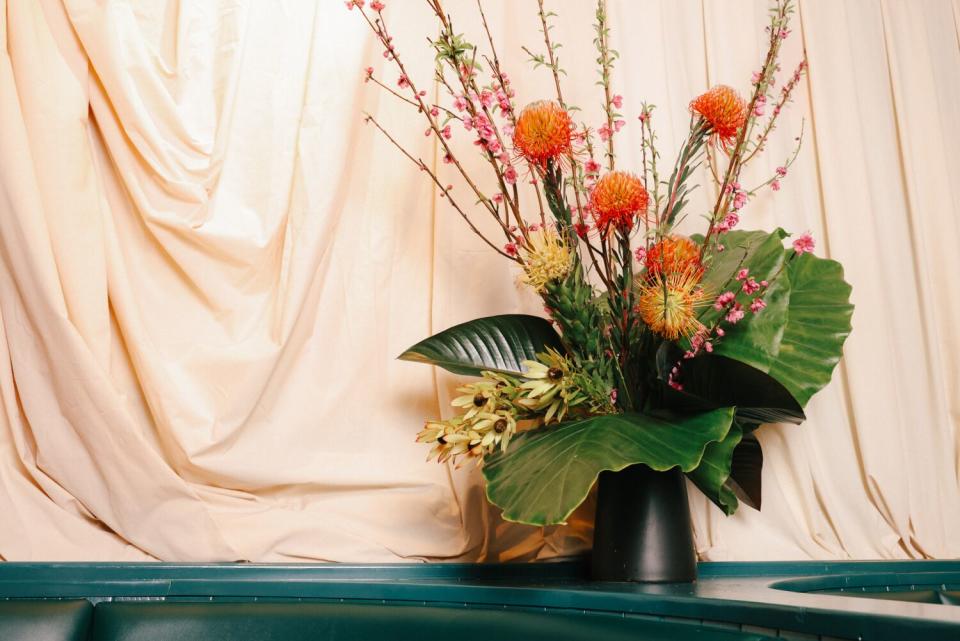 A flower arrangement decorates the main dining area at Bar Chelou.