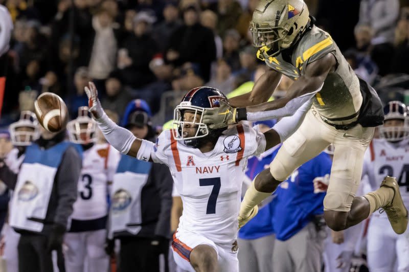 Cornerback Mbiti Williams Jr. (L) will be among several Navy defenders who face Notre Dame and quarterback Sam Hartman on Saturday in Dublin. File Photo by Laurence Kesterston/UPI
