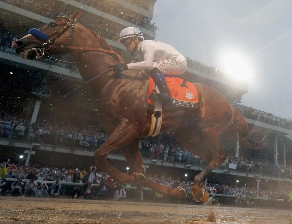 LOUISVILLE, KY - MAY 05:  Justify #7, ridden by jockey Mike Smith crosses the finish line to win the 144th running of the Kentucky Derby at Churchill Downs on May 5, 2018 in Louisville, Kentucky.  (Photo by Rob Carr/Getty Images)