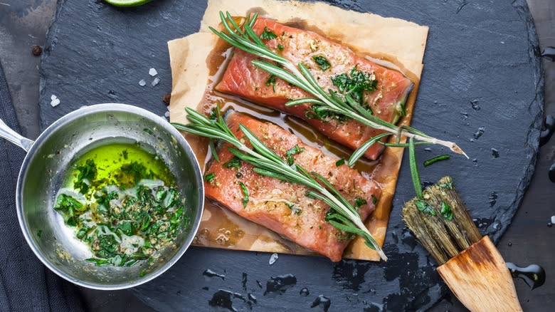 Salmon coated in marinade of fresh herbs