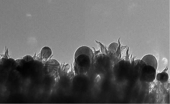 Oak Ridge researchers developed a catalyst made of copper nanoparticles (seen as spheres) embedded in carbon nanospikes that can convert carbon dioxide into ethanol.