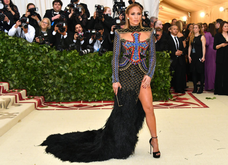 <p>Dia Dipasupil/WireImage</p><p>Jennifer Lopez was on theme in a big way at the <a href="https://parade.com/668594/paulettecohn/photos-the-best-from-the-2018-met-gala-red-carpet/" rel="nofollow noopener" target="_blank" data-ylk="slk:2018 Met Gala;elm:context_link;itc:0;sec:content-canvas" class="link ">2018 Met Gala</a>, rocking a bejeweled cross bodice on her Balmain gown for the "Heavenly Bodies: Fashion and the Catholic Imagination" exhibition.</p>