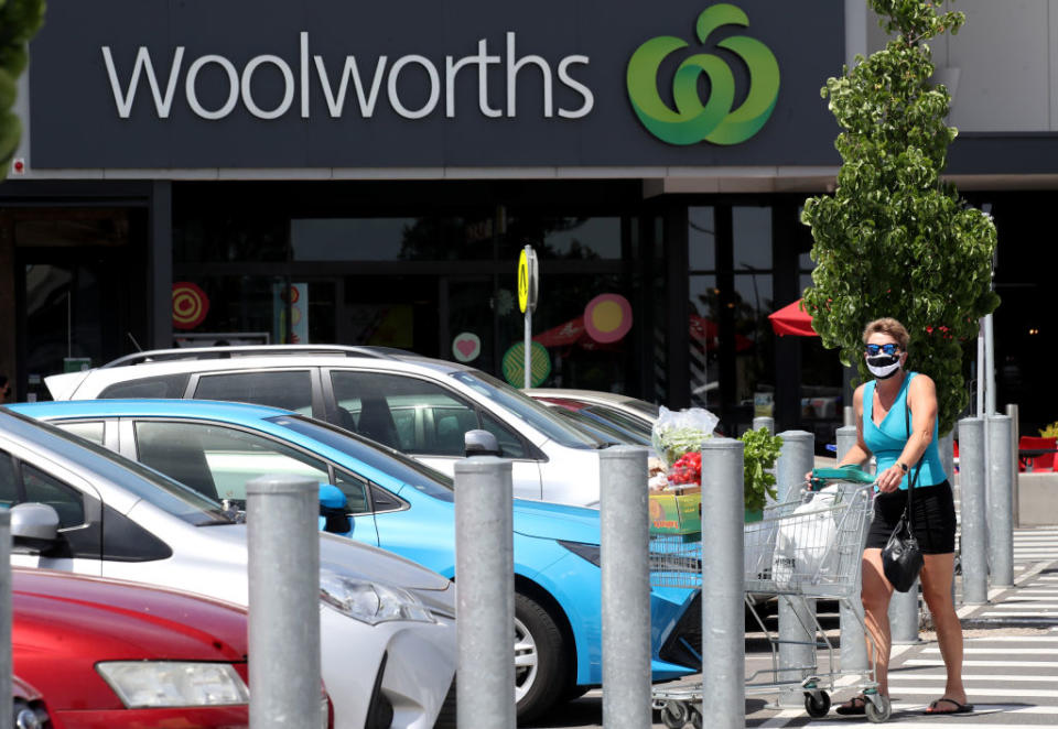 A lady in a mask leaves Woolworths at West Torrens in Adelaide, Australia. 