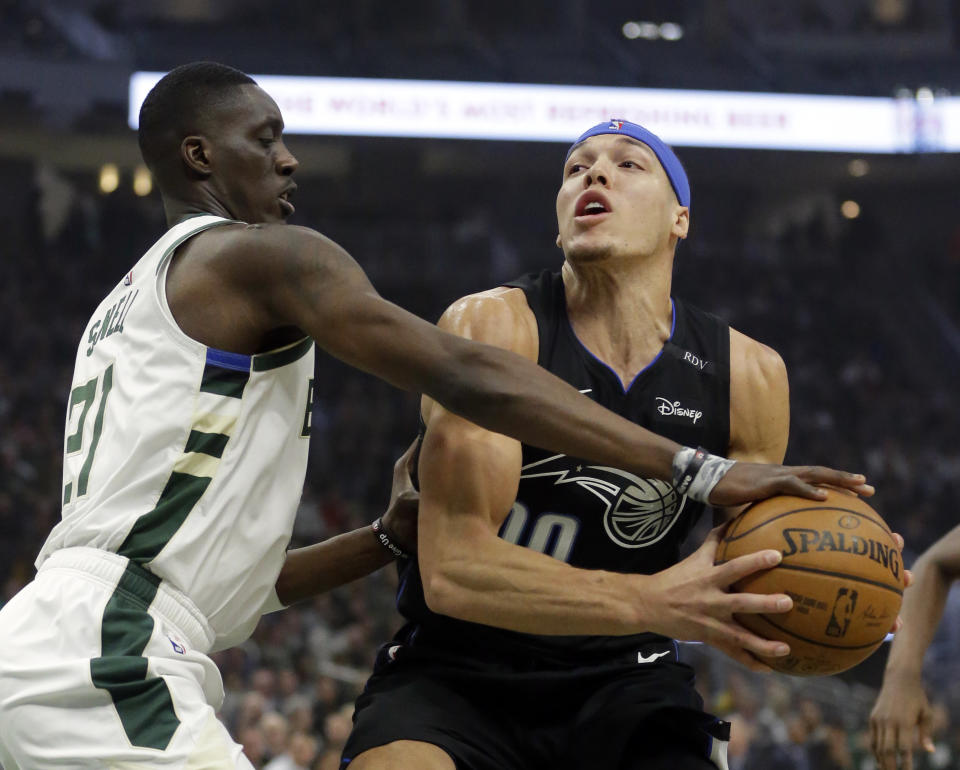 Orlando Magic's Aaron Gordon looks to shoot against Milwaukee Bucks' Tony Snell during the first half of an NBA basketball game Saturday, Feb. 9, 2019, in Milwaukee. (AP Photo/Aaron Gash)