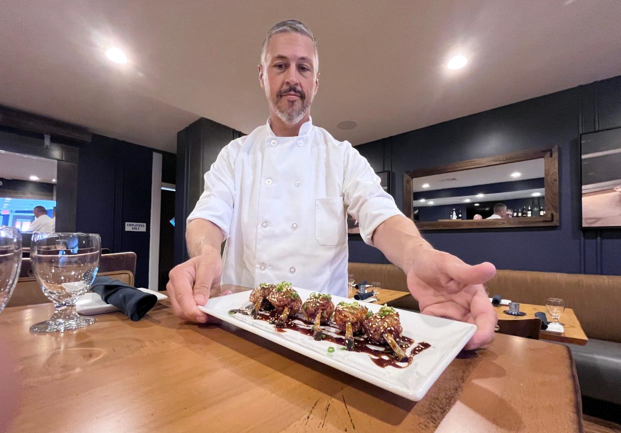 Chef Michael Wendt with chicken lollipops at the Club Car Grille in Irvington May 9, 2024.