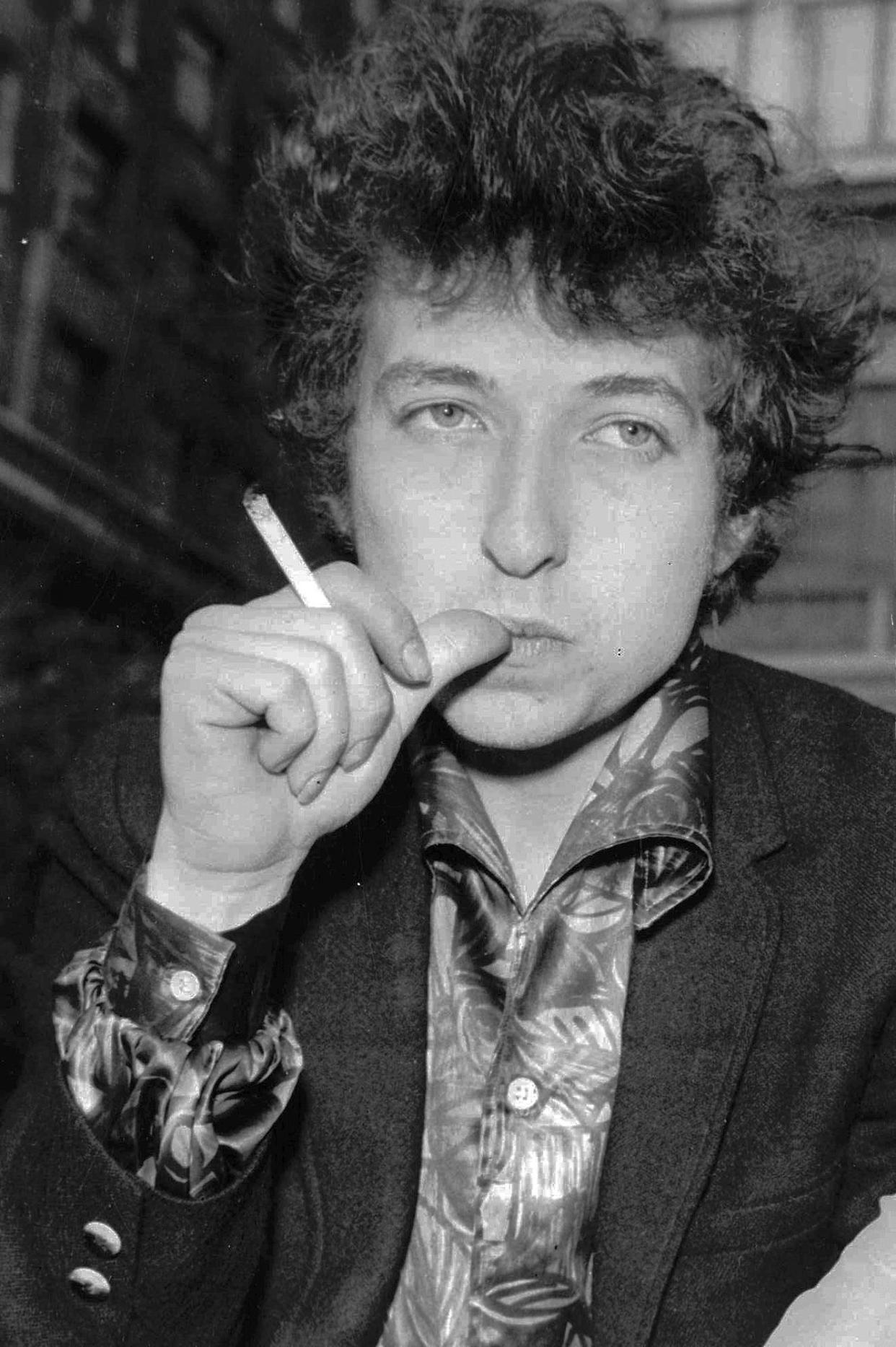 FILE - Musician Bob Dylan appears in London on April 27, 1965. Transcripts of lost 1971 Dylan interviews with the late American blues artist Tony Glover and letters the two exchanged reveal that Dylan changed his name from Robert Zimmerman because he worried about anti-Semitism, and that he wrote "Lay Lady Lay" for actress Barbra Streisand. The items are among a trove of Dylan archives being auctioned in November 2020, by Boston-based R.R. Auction.
