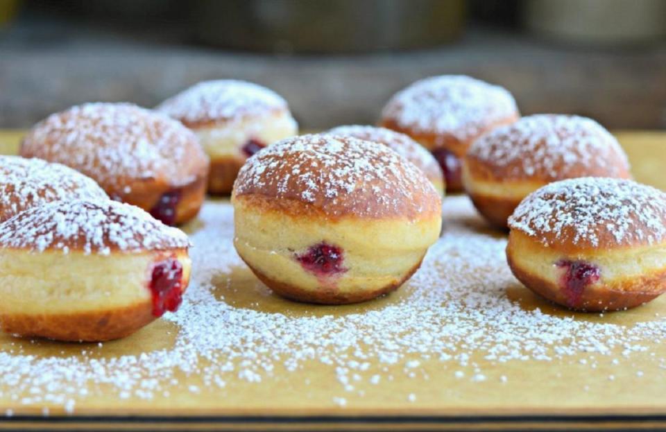 <p>Sufganiyot, better known as jelly doughnuts, come in a close second to latkes in the Hanukkah food canon. You can always buy them at <a href="https://www.thedailymeal.com/eat/best-doughnuts-every-state-slideshow?referrer=yahoo&category=beauty_food&include_utm=1&utm_medium=referral&utm_source=yahoo&utm_campaign=feed" rel="nofollow noopener" target="_blank" data-ylk="slk:your best local doughnut shop;elm:context_link;itc:0;sec:content-canvas" class="link ">your best local doughnut shop</a>, but if you feel truly festive and ambitious, you can make them at home too.</p> <p><a href="https://www.thedailymeal.com/best-recipes/sufganiyot-recipe?referrer=yahoo&category=beauty_food&include_utm=1&utm_medium=referral&utm_source=yahoo&utm_campaign=feed" rel="nofollow noopener" target="_blank" data-ylk="slk:For the Sufganiyot recipe, click here.;elm:context_link;itc:0;sec:content-canvas" class="link ">For the Sufganiyot recipe, click here.</a></p>