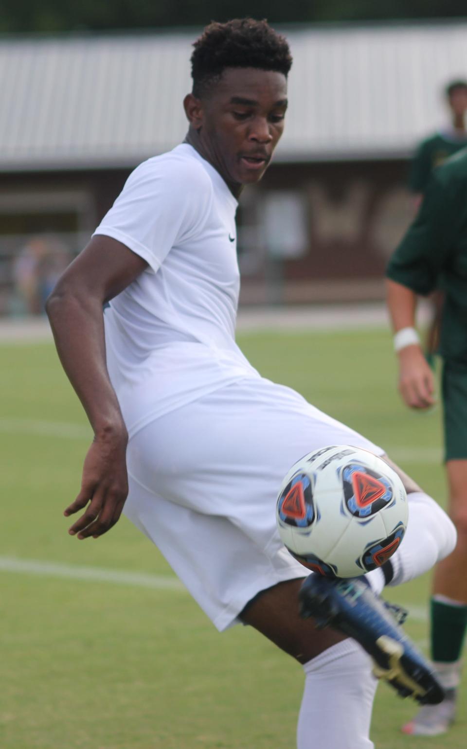 Levonte Brown keeps his eyes on the ball during a game at White Oak this season.