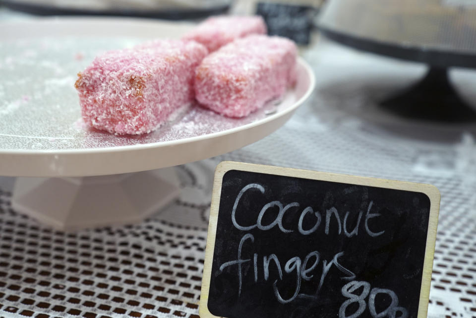 Coconut fingers, a traditional celebration dessert of iced sponge cake dusted with coconut, are displayed at a restaurant on the island of St. Helena on Saturday, Feb. 24, 2024. (AP Photo/Nicole Evatt)