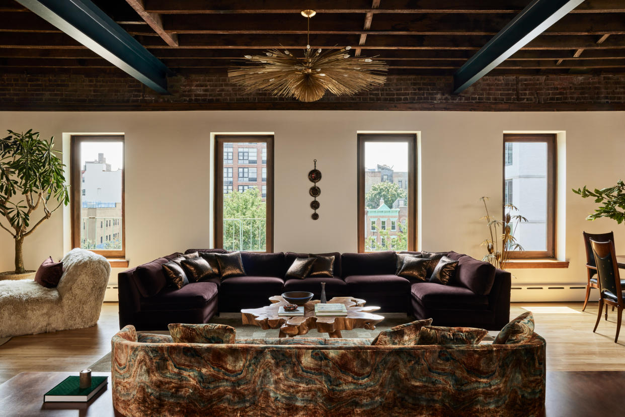  A textured living room with patterned sofa. 