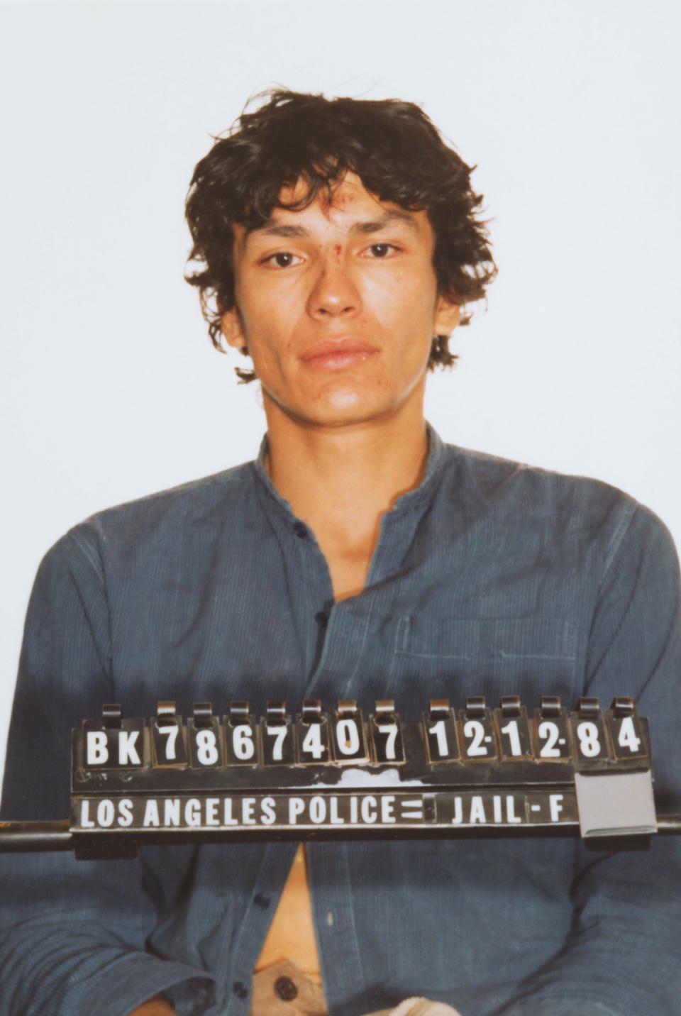 Colorized mugshot of Richard Ramirez.