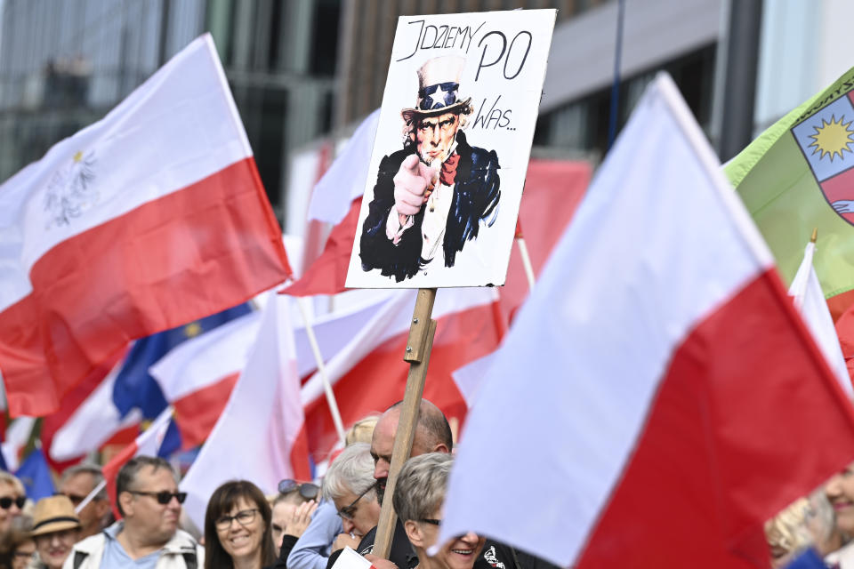 A Uncle Sam poster with the slogan "We come to you" is showing by demonstrators during a march to support the opposition against the governing populist Law and Justice party in Warsaw, Poland, Sunday, Oct. 1, 2023. Polish opposition leader Donald Tusk seeks to boost his election chances for the parliament elections on Oct. 15, 2023, leading the rally in the Polish capital. (AP Photo/Rafal Oleksiewicz)