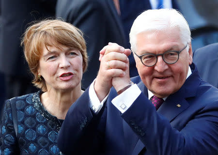 German President Frank-Walter Steinmeier and wife Elke Buedenbender greet people during German Unification Day celebrations in Mainz, Germany, October 3, 2017. REUTERS/Kai Pfaffenbach