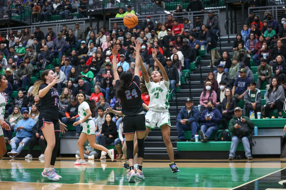 Farmington's Kjani Anitielu shoots a jumper over Sandia's Sydney Benally (24) in the second quarter on Tuesday, January 17, 2023 at the Scorpion Arena.