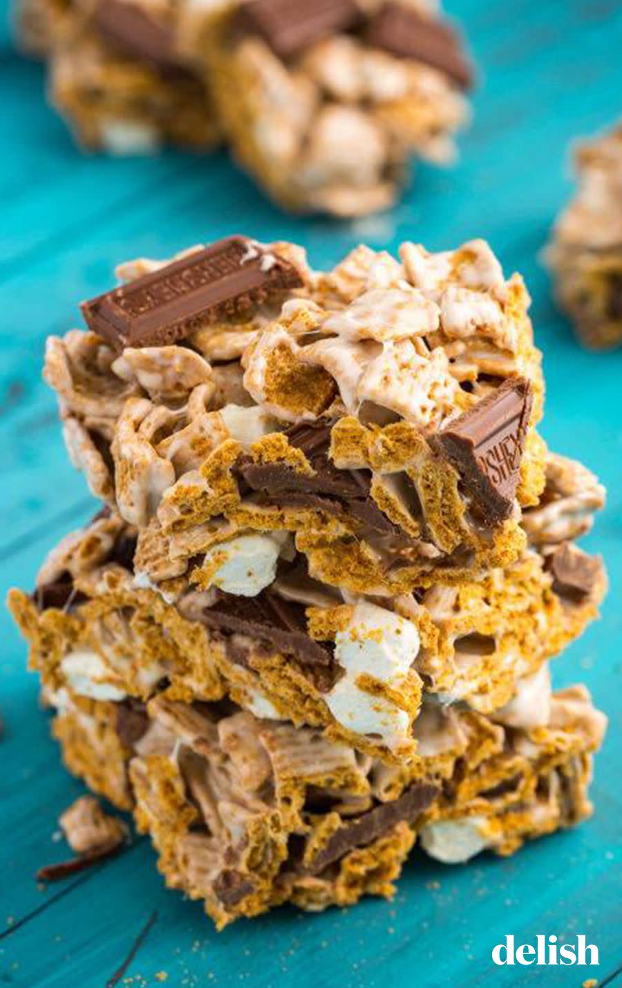 <p>We're not exaggerating when we say we're obsessed with this combination of <a href="https://www.delish.com/cooking/recipe-ideas/a27044914/rice-krispies-treats-recipe/" rel="nofollow noopener" target="_blank" data-ylk="slk:Rice Krispies treats;elm:context_link;itc:0;sec:content-canvas" class="link ">Rice Krispies treats</a> and <a href="https://www.delish.com/cooking/recipe-ideas/g2782/smores/" rel="nofollow noopener" target="_blank" data-ylk="slk:s'mores;elm:context_link;itc:0;sec:content-canvas" class="link ">s'mores</a>. Swapping Golden Grahams cereal is our favorite new game-changer.</p><p>Get the <strong><a href="https://www.delish.com/cooking/recipe-ideas/recipes/a47627/smores-bars-recipe/" rel="nofollow noopener" target="_blank" data-ylk="slk:S'mores Krispie Treats recipe;elm:context_link;itc:0;sec:content-canvas" class="link ">S'mores Krispie Treats recipe</a></strong>.</p>