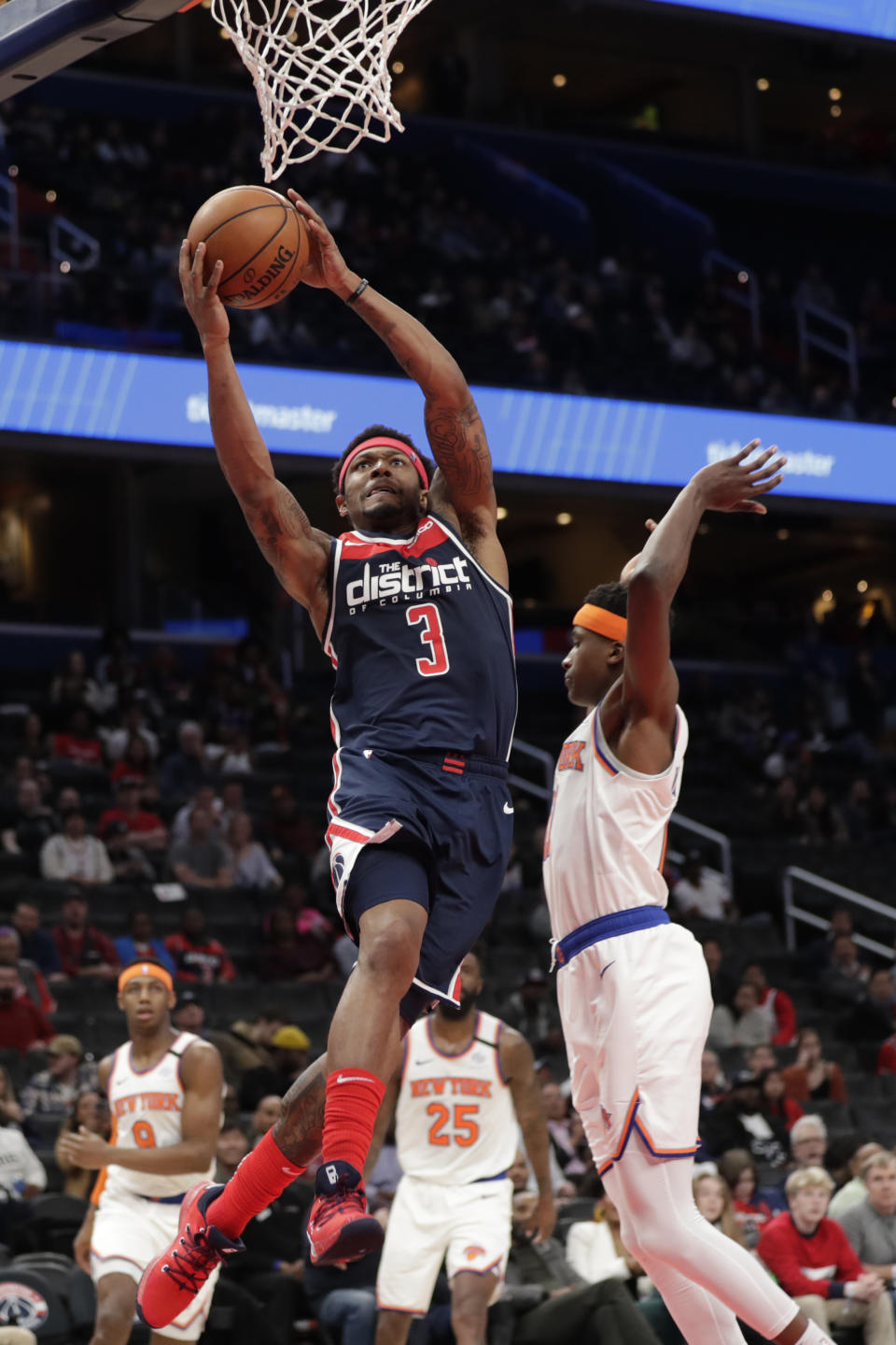 Washington Wizards' Bradley Beal (3) goes up for a dunk during the second half of the team's NBA basketball game against New York Knicks, Tuesday, March 10, 2020, in Washington. (AP Photo/Luis M. Alvarez)