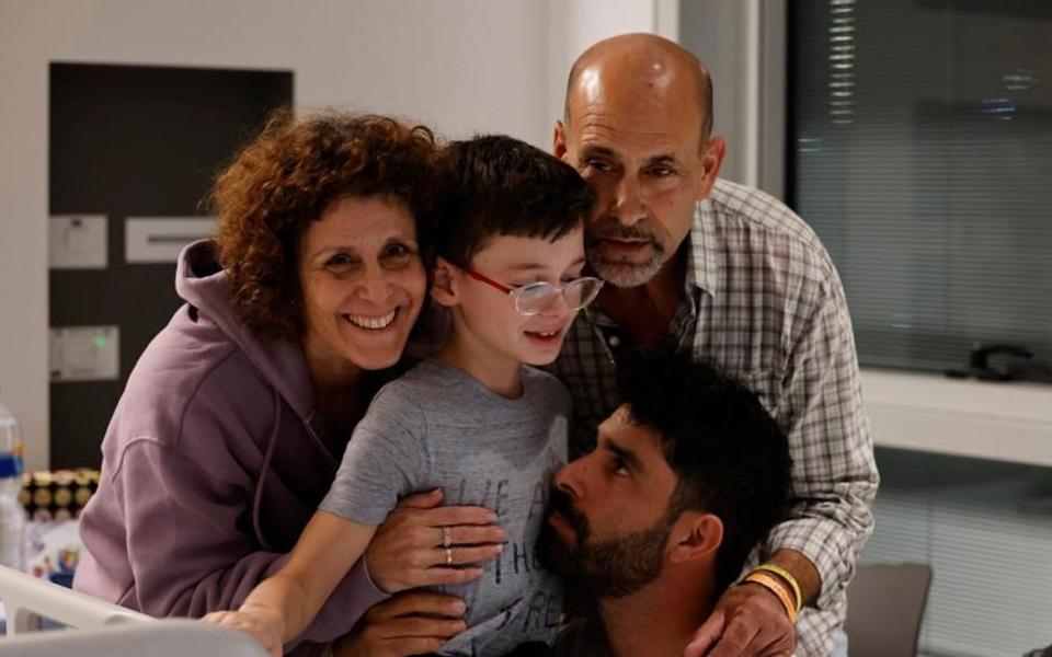 Ohad Munder meets his family members at the Schneider Children's Medical Center in Israel on 25 November