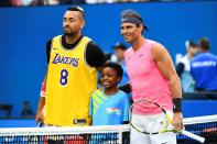 Australia's Nick Kyrgios (L) wears a Los Angeles Lakers jersey with former basketball player Kobe Bryant's number as he poses with Spain's Rafael Nadal before the start of their men's singles match on day eight of the Australian Open tennis tournament in Melbourne on January 27, 2020. (Photo by William WEST / AFP)