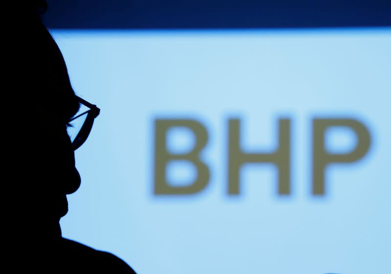 FILE PHOTO: BHP's logo is projected on a screen during a round-table meeting with journalists