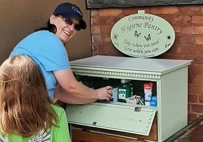 <em>Photo courtesy of Reform Congress: Liz Terwilliger restocking the original hygiene pantry.</em>