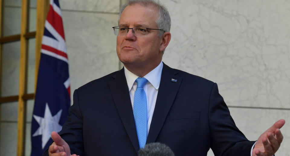 Scott Morrison reacts during a press conference in the Prime Ministers courtyard on December 11, 2020 in Canberra. Source: Getty Images