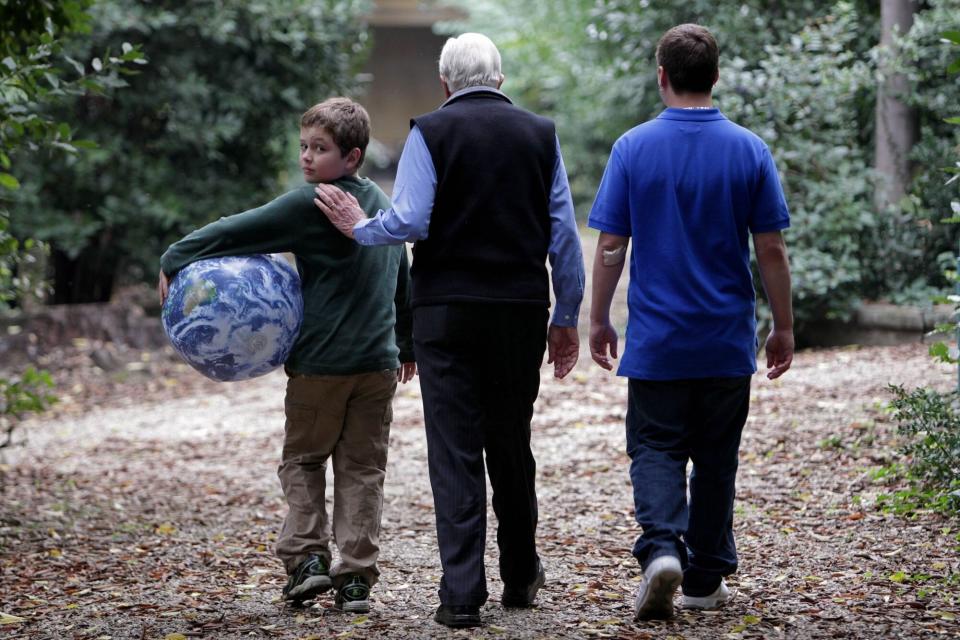 ISTANBUL, TURKEY - OCTOBER 31: (NO SALES) In this handout image provided by the Elders, Jimmy Carter walks with his grandsons Jeremy Carter (R), 22, and Hugo Wentzel, 10 during a picnic event on October 31, 2009 in Istanbul, Turkey. Jimmy Carter, Desmond Tutu and their fellow Elders invited their grandchildren to join them this week to remind the world of the catastrophic risk of climate change to future generations. The seven Elders and their thirteen grandchildren from Asia, Africa, Europe and America met in Istanbul with the group ranging in age from 3 to 85. (Photo by Jeff Moore/The Elders via Getty Images)