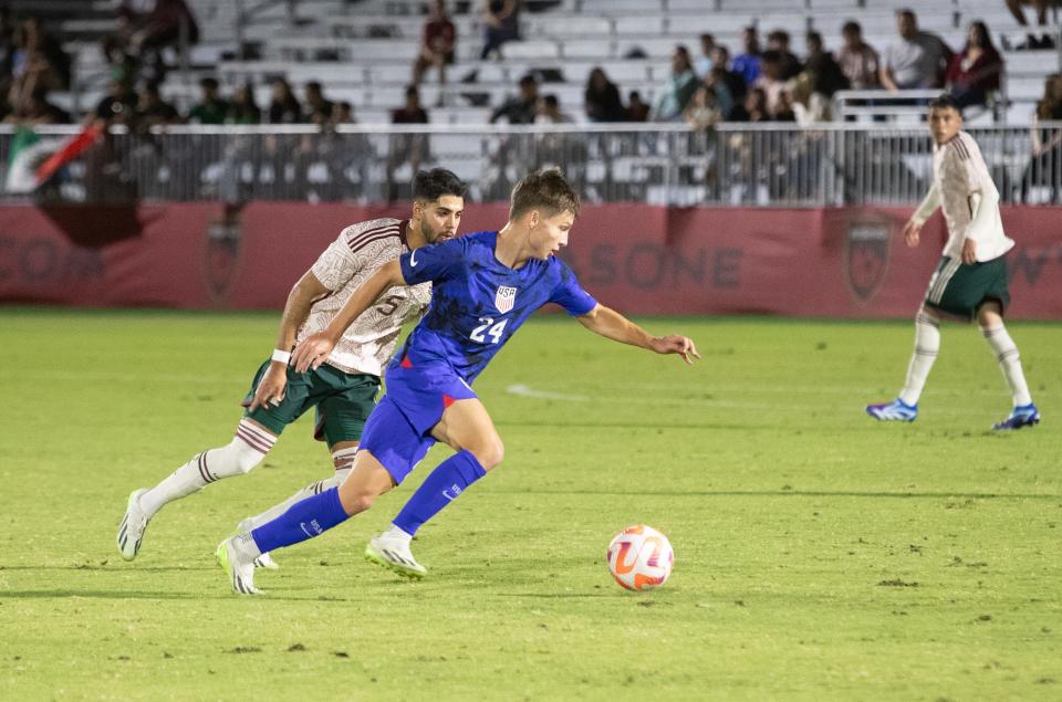 USA forward Esmir Bajraktarevic (24) and Mexico defender Isais Mauricio (5) race or the ball at Phoenix Rising FC Stadium on Oct. 11, 2023.
Nicole Mullen/The Republic