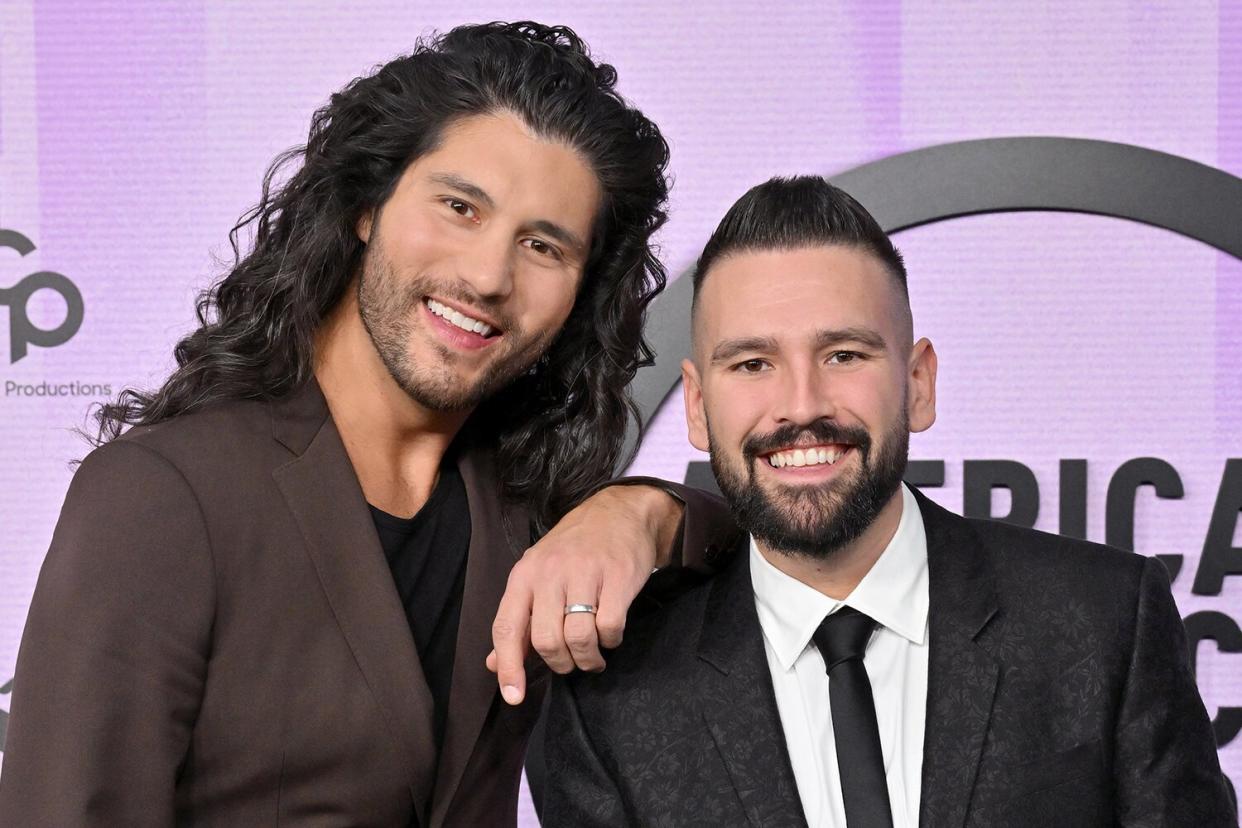 Dan Smyers and Shay Mooney of Dan + Shay attend the 2022 American Music Awards at Microsoft Theater on November 20, 2022 in Los Angeles, California.