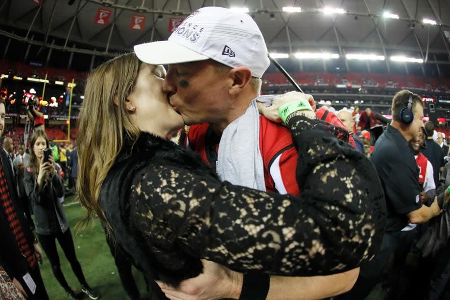 Matt Ryan kisses with his wife Sarah Marshall after the Falcons beat the Green Bay Packers in the NFC Championship Game at the Georgia Dome on January 22.