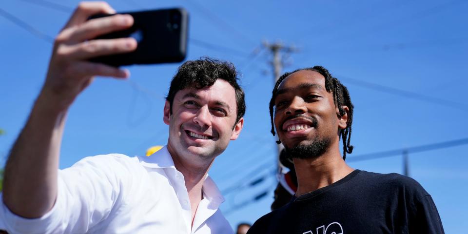 Jon Ossoff takes a selfie during a Juneteenth celebration