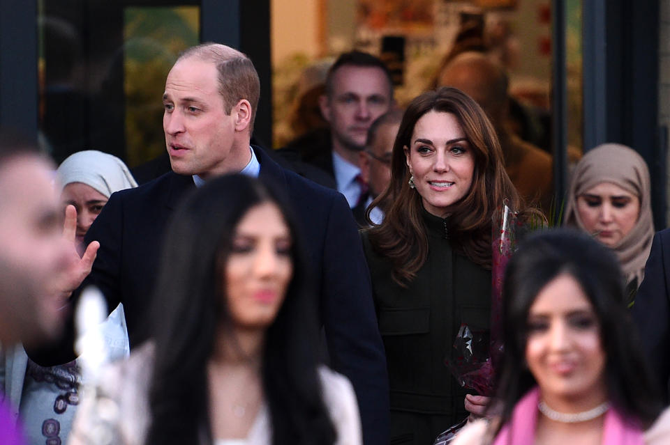 Britain's Prince William, Duke of Cambridge and Britain's Catherine, Duchess of Cambridge gesture as they leave after a visit to the Khidmat Centre, Bradford on January 15, 2020, to learn about the activities and workshops offered by the centre. (Photo by Oli SCARFF / AFP) (Photo by OLI SCARFF/AFP via Getty Images)
