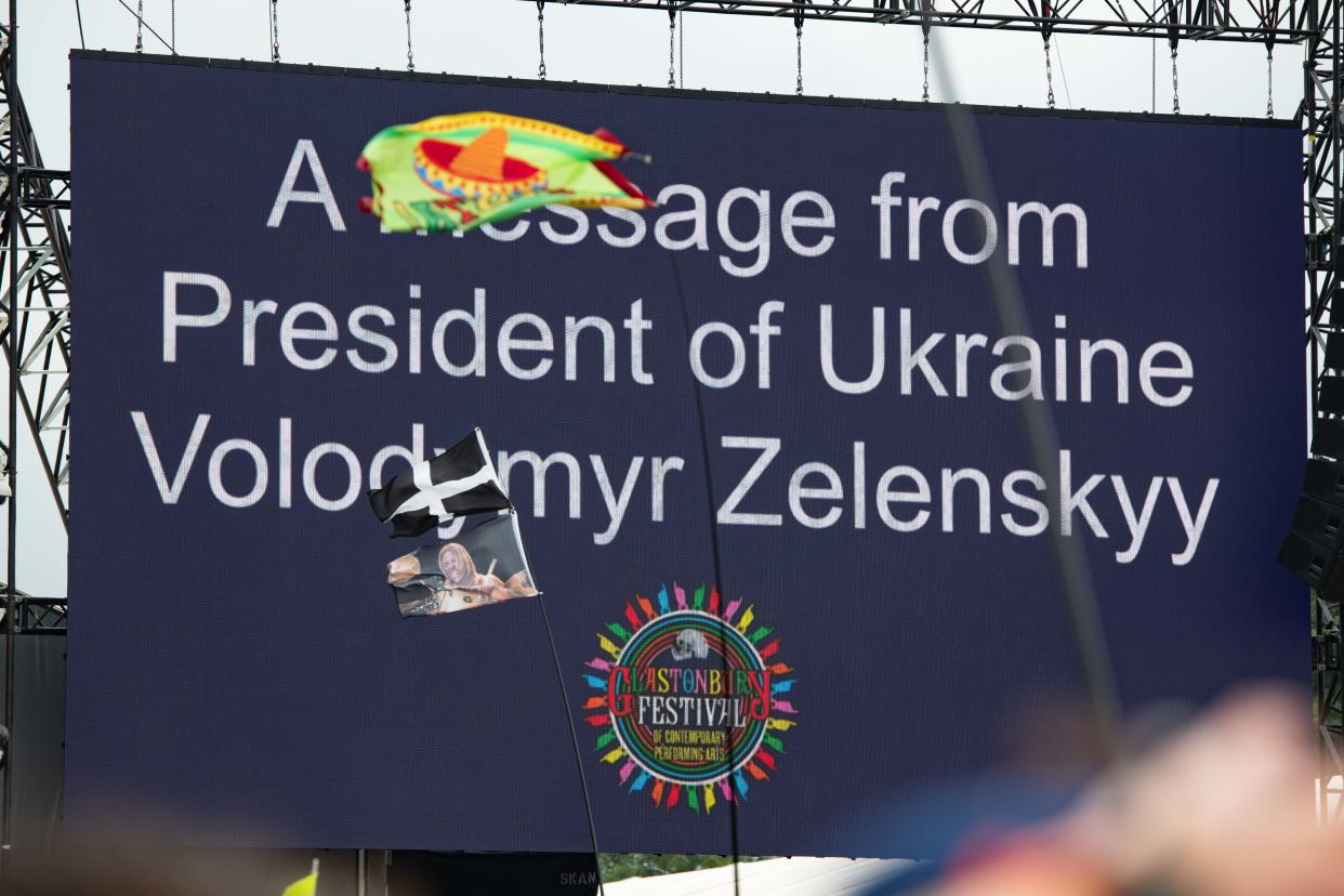 GLASTONBURY, ENGLAND - JUNE 24: A message from the President of Ukraine Volodymyr Zelenskyy opens the Other Stage during day three of Glastonbury Festival at Worthy Farm, Pilton on June 24, 2022 in Glastonbury, England. (Photo by Joseph Okpako/WireImage)