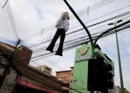 An effigy is seen at a street in Cochabamba