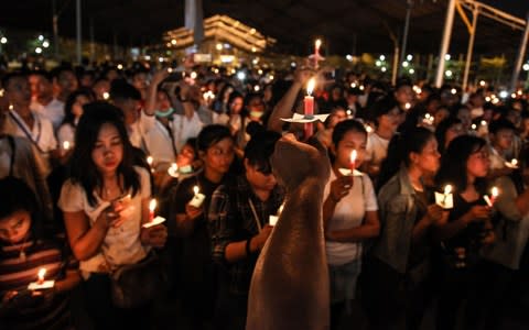 A candlelight vigil in the city of Medan on Indonesia's Sumatra island to support the victims and their relatives of a series attacks at churches in Surabaya - Credit:  IVAN DAMANIK/AFP