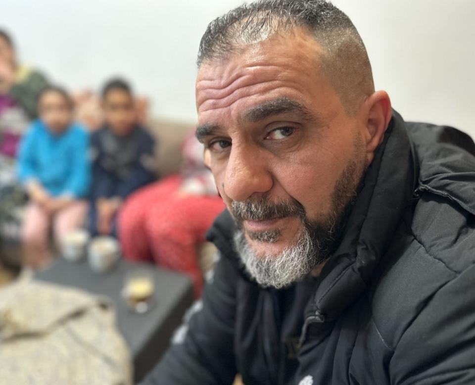 Fayez al Dibs, who has seen three of his five sons arrested by Israeli authorities, sits in his home.