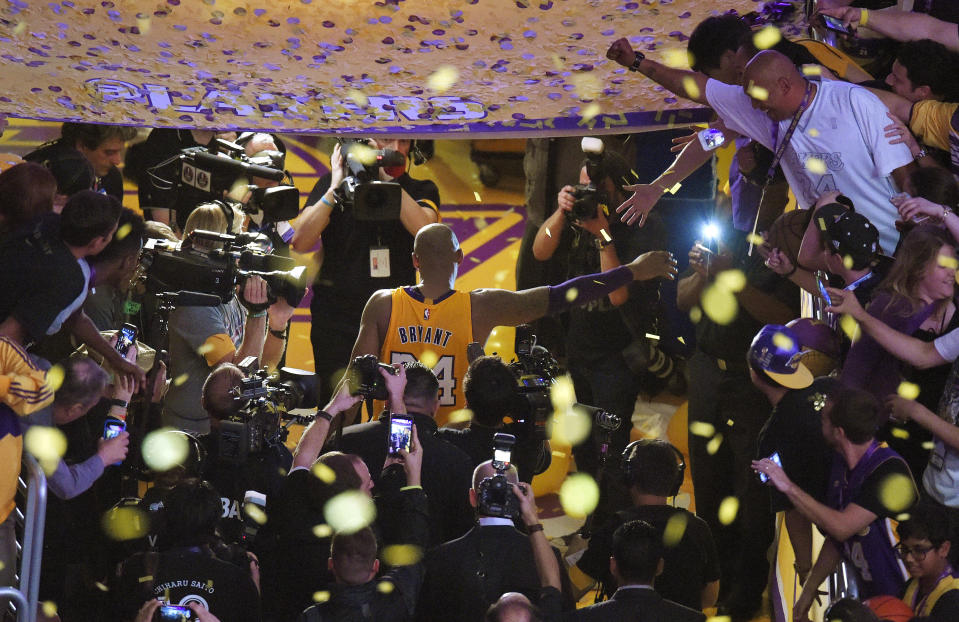 FILE - In this April 13, 2016, file photo, Los Angeles Lakers forward Kobe Bryant walks off the court after finishing his last NBA basketball game before retirement in Los Angeles. Bryant, the 18-time NBA All-Star who won five championships and became one of the greatest basketball players of his generation during a 20-year career with the Los Angeles Lakers, died in a helicopter crash Sunday, Jan. 26, 2020. (AP Photo/Mark J. Terrill, File)