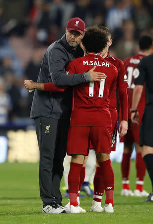 Soccer Football - Premier League - Huddersfield Town v Liverpool - John Smith's Stadium, Huddersfield, Britain - October 20, 2018 Liverpool manager Juergen Klopp embraces Mohamed Salah at the end of the match Action Images via Reuters/Carl Recine