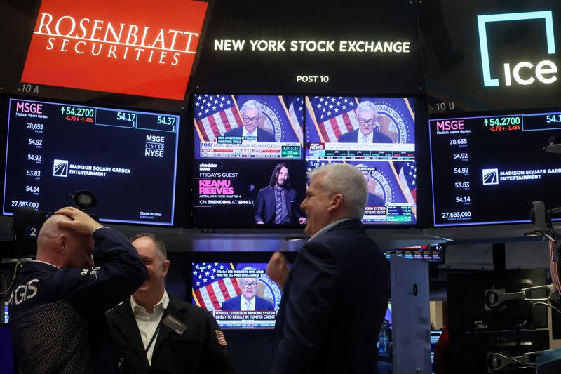 Traders react to Fed rate announcement on the floor of the NYSE in New York