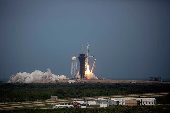 CAPE CANAVERAL, FLORIDA - MAY 30: The SpaceX Falcon 9 rocket launches into space with NASA astronauts Bob Behnken (R) and Doug Hurley aboard the rocket from the Kennedy Space Center on May 30, 2020 in Cape Canaveral, Florida. The inaugural flight is the first manned mission since the end of the Space Shuttle program in 2011 to be launched into space from the United States. (Photo by Saul Martinez/Getty Images)