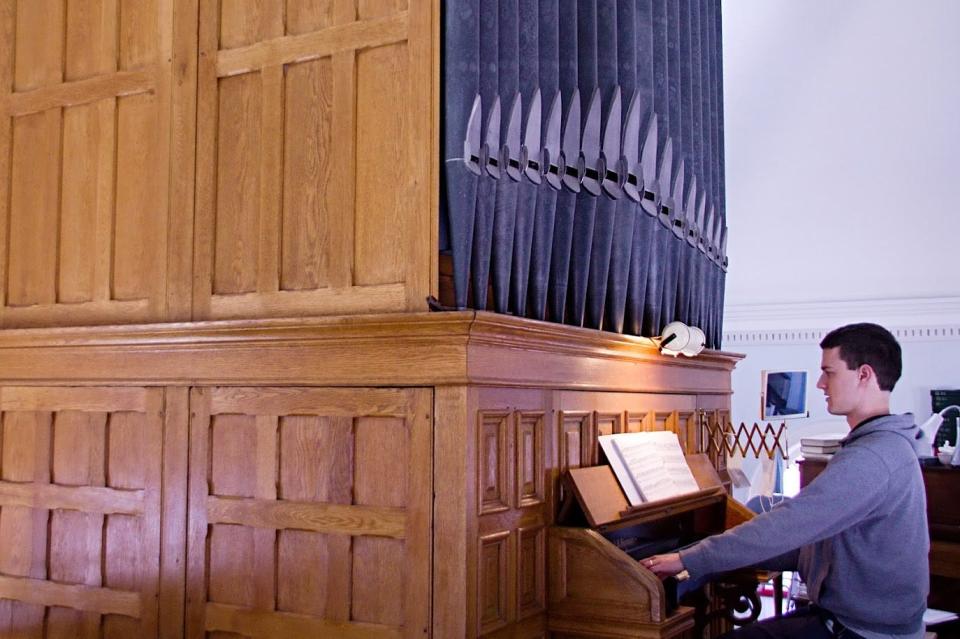 Michael Kearney rehearsing on the pipe organ at Holy Trinity Evangelical Lutheran Church in Beaver.