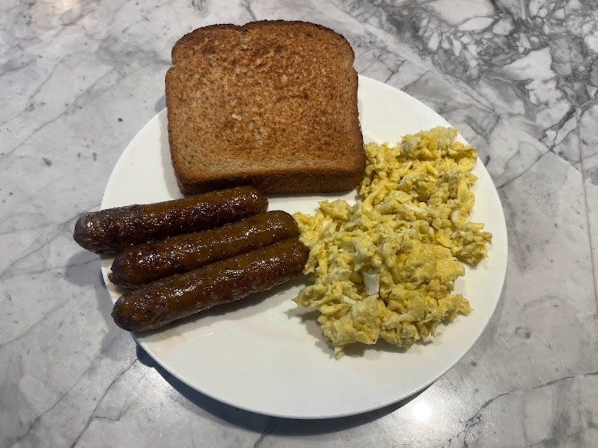 Sausage on a plate with toast and eggs