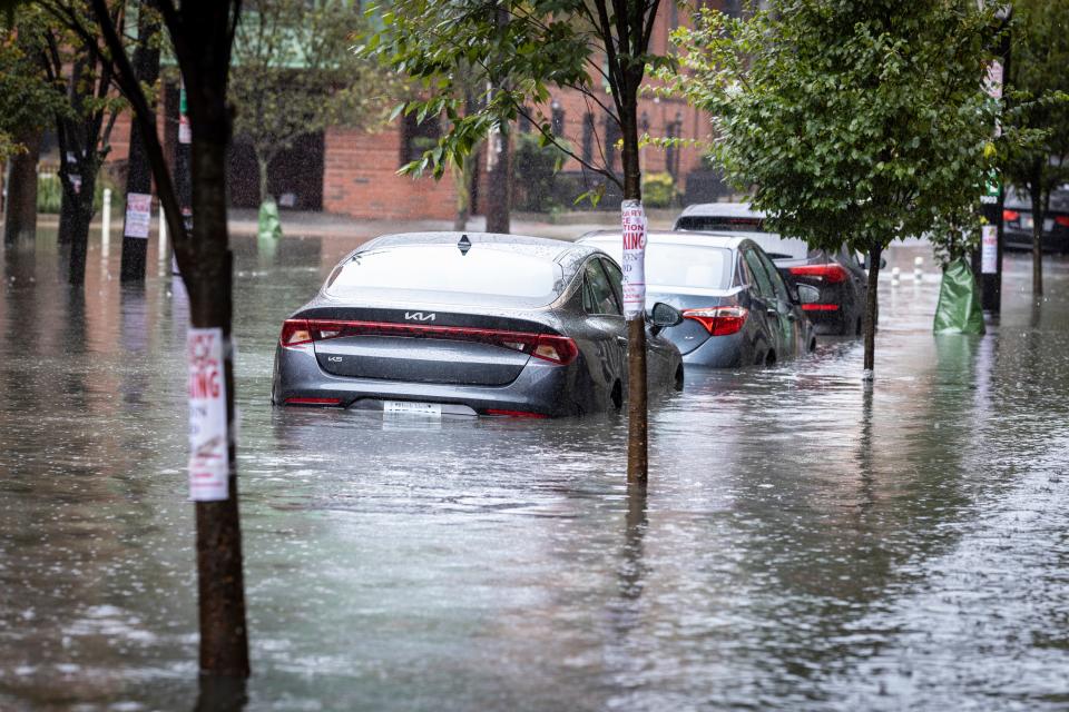 Cars sit parked in deep water as heavy rains cause streets to flood in Hoboken, N.J., on Friday, Sept. 29, 2023. (AP Photo/Stefan Jeremiah)