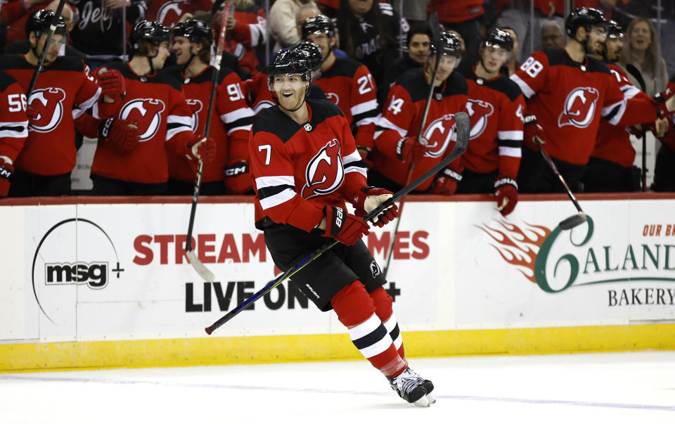 New Jersey Devils defenseman Dougie Hamilton smiles after scoring a goal against the Arizona Coyotes during the second period of an NHL hockey game Friday, Oct. 13, 2023, in Newark, N.J. (AP Photo/Noah K. Murray)