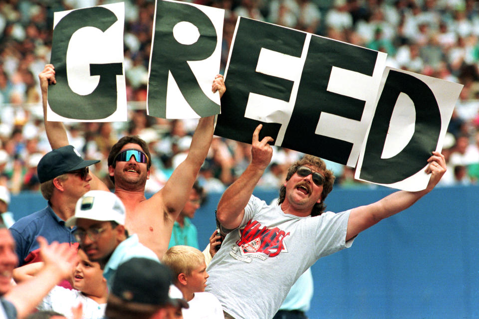 Baseball fans at Yankee Stadium hold up letters spelling the word Greed during the New York Yankees game against the Toronto Blue Jays in New York City, Thursday, Aug. 11, 1994.  Baseball players may go on strike Friday.  (AP Photo/Luc Novovitch)