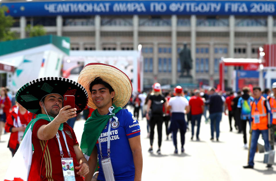 <p>Mexico fans take a selfie outside the stadium ahead of kick off. (Rex) </p>