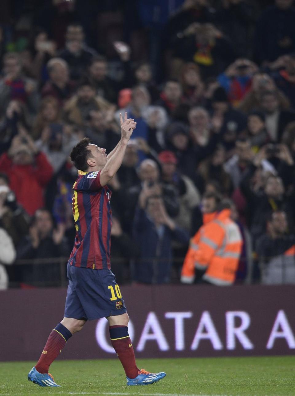 FC Barcelona's Lionel Messi, from Argentina, reacts after scoring against Getafe during a Copa del Rey soccer match at the Camp Nou stadium in Barcelona, Spain, Wednesday, Jan. 8, 2014. (AP Photo/Manu Fernandez)