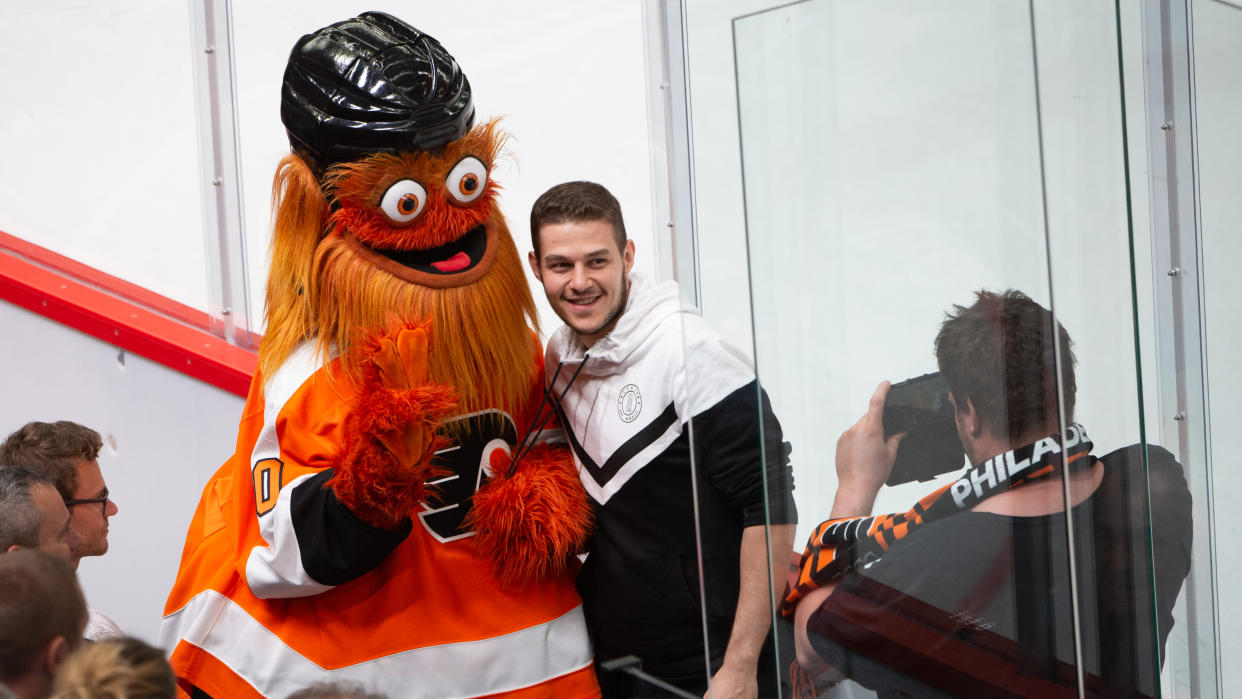 LAUSANNE, SWITZERLAND - SEPTEMBER 30: Mascot Gritty takes a photo with fans during the NHL Global Series Challenge Switzerland 2019 match between Philadelphia Flyers and Lausanne HC at Vaudoise Arena on September 30, 2019 in Lausanne, Switzerland. (Photo by Robert Hradil/NHLI via Getty Images)