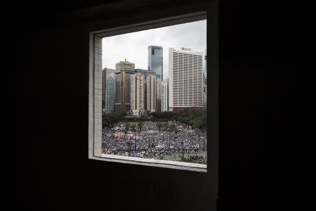 Thousands of pro-democracy protesters gather to march in the streets to demand universal suffrage in Hong Kong, in this July 1, 2014 file picture. REUTERS/Tyrone Siu/Files