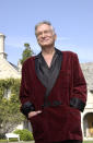 <p>Hugh Hefner was not only a fan of silky two-piece pyjamas but the velvet smoking jacket. Here, the Playboy tycoon is pictured at his mansion. <em>[Photo: Getty]</em> </p>