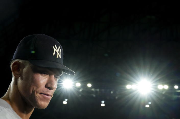 New York Yankees' Aaron Judge listens during an interview after the team's baseball game against the Toronto Blue Jays, in which he hit his 61st home run of the season, Wednesday, Sept. 28, 2022, in Toronto. (Nathan Denette/The Canadian Press via AP)